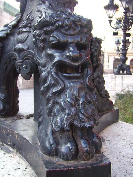 Testy face of lion on lamppost base in Budapest  photo